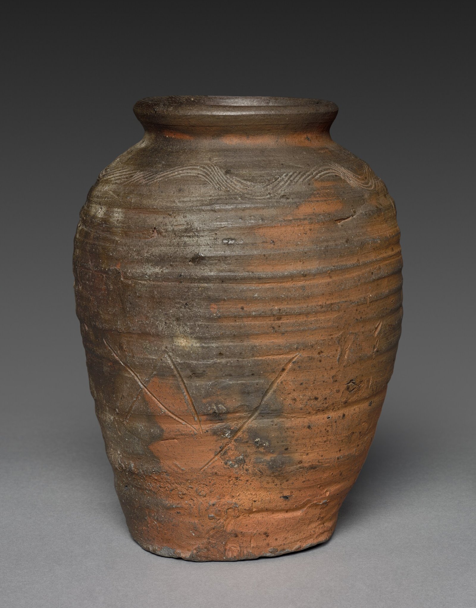 Bizen stoneware storage jar with natural ash glaze and an incised potter mark