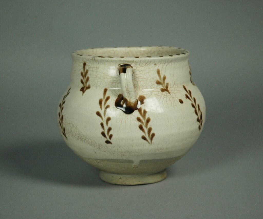 Cizhou stoneware jar painted in brown on white slip under a transparent glaze, 12th century. The Metropolitan Museum of Art, accession 42.191.
