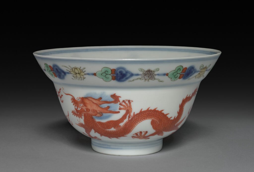 Porcelain bowl with a red dragon in doucai decoration, underglaze blue outlines filled with overglaze enamels, Yongzheng mark and reign. Cleveland Museum of Art, 1940.956.