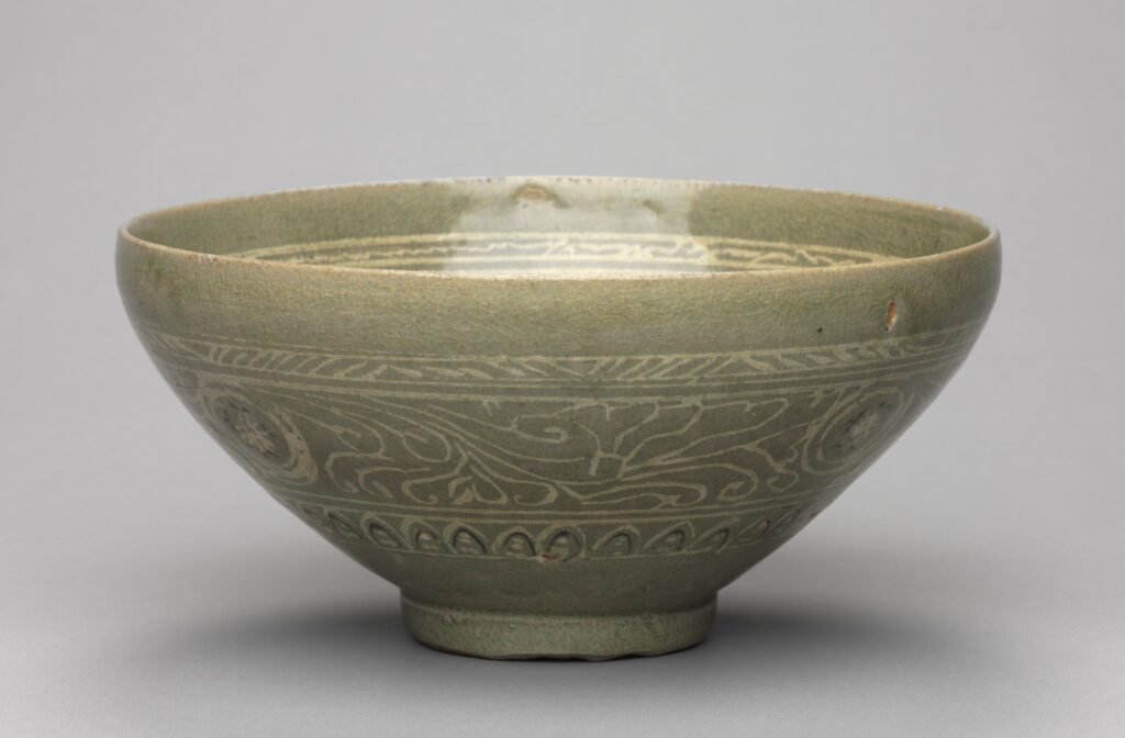 Wide Goryeo celadon tea bowl with inlaid waterfowl, willow and reed design, thirteen hundreds. Cleveland Museum of Art, 1918.458.