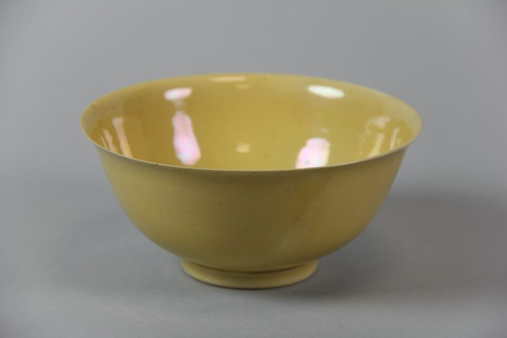Canary yellow glazed porcelain bowl, Jingdezhen, Kangxi mark and period 1662 to 1722. The Metropolitan Museum of Art, accession 79.2.961, Open Access.