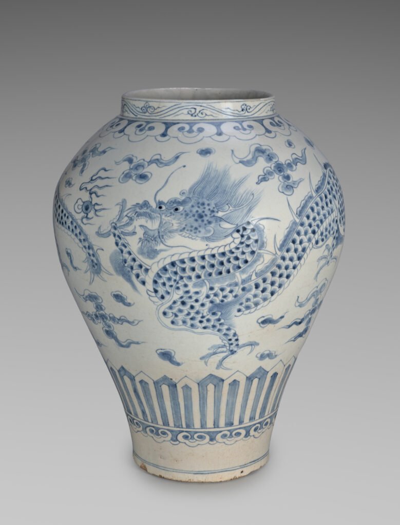 Tall Joseon porcelain jar painted in underglaze blue with a dragon chasing a flaming jewel through clouds, seventeen hundreds. Cleveland Museum of Art, 1986.85.