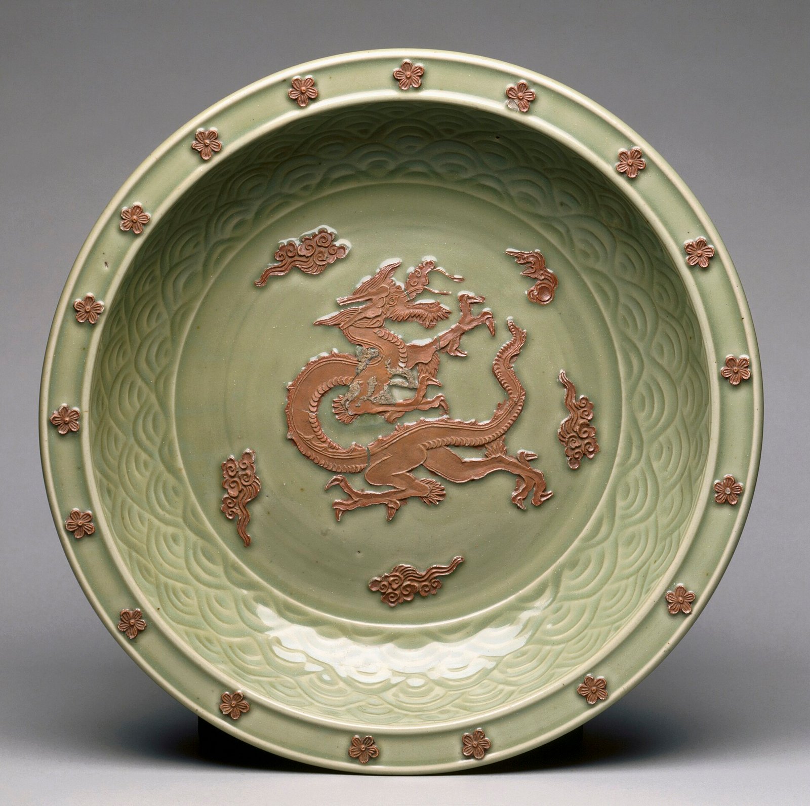 Longquan celadon plate with a moulded dragon among clouds, Yuan dynasty