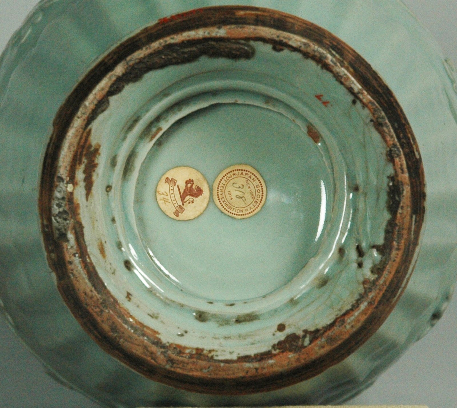 The unglazed base of a Yuan Longquan vase, fired orange-brown where the body is exposed