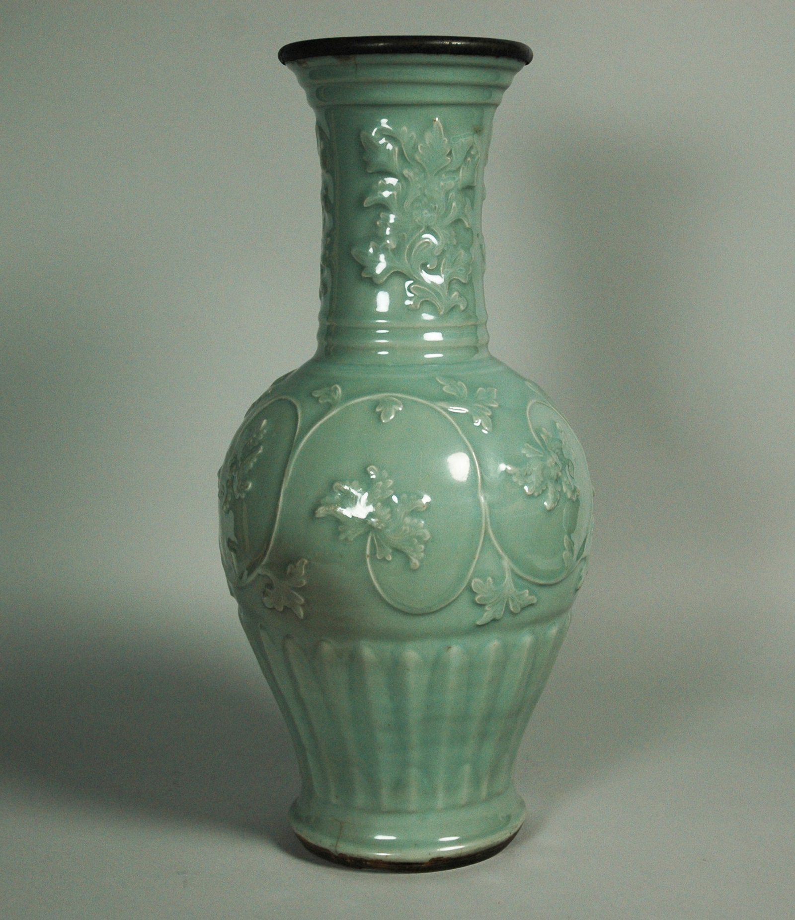 Longquan vase with moulded peony scrolls under a celadon glaze, mid-14th century Yuan dynasty