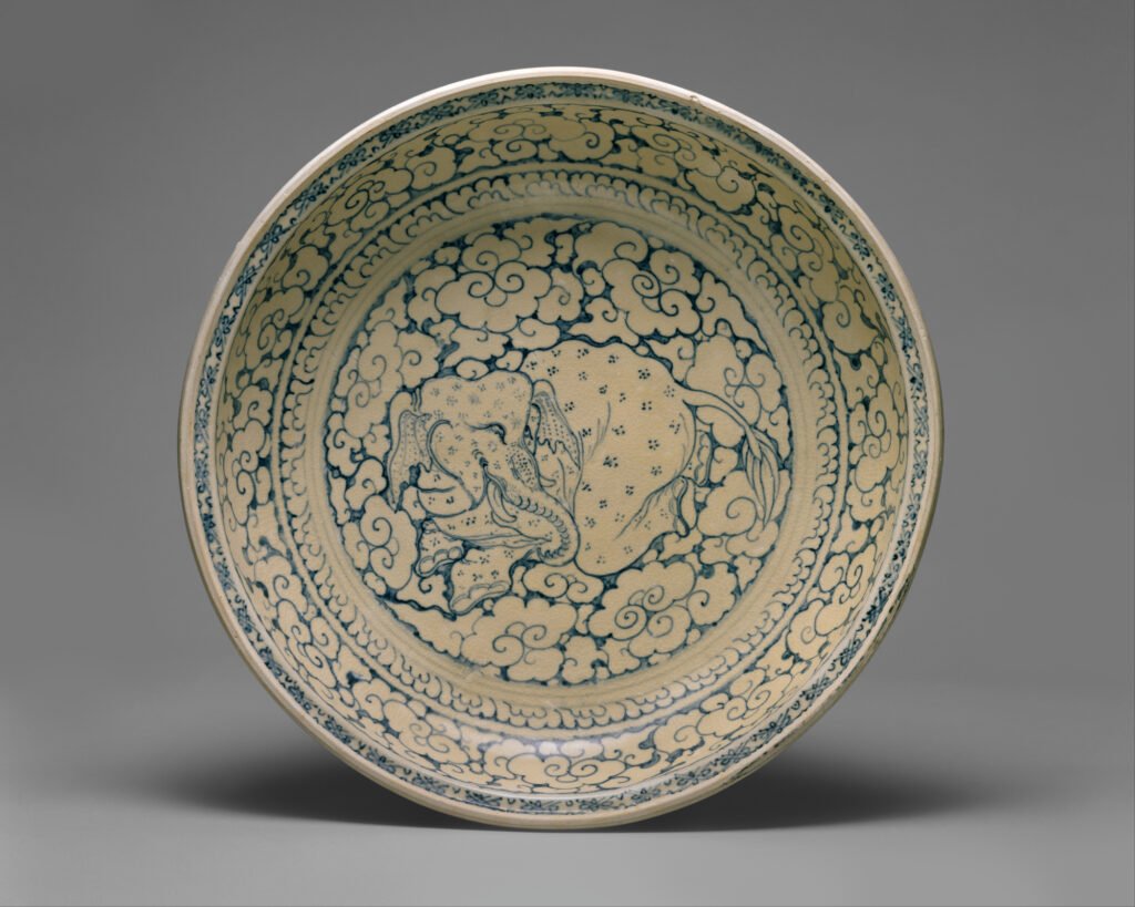 Large Vietnamese stoneware dish painted in underglaze blue with a recumbent elephant surrounded by clouds, fifteenth to sixteenth century. The Metropolitan Museum of Art, 1998.213.