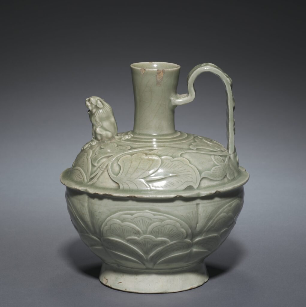 Yaozhou ware ewer with a lion-shaped spout and carved lotus decoration under an olive-green glaze, tenth to eleventh century. Cleveland Museum of Art, 1948.220.